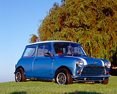AUT 22 RK2009 01
1962 Morris Mini 850 Blue White Stripe Low 3/4 Side View On Grass By Tree