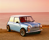 AUT 22 RK2010 01
1962 Morris Mini 850 Blue White Stripe 3/4 Front View On Sand By Water