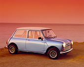 AUT 22 RK2011 01
1962 Morris Mini 850 Blue With White Stripes 3/4 Front View On Sand By Ocean