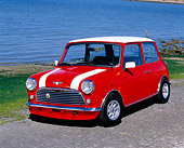 AUT 22 RK2020 01
1968 Austin Mini Cooper MK I Orange White Stripes 3/4 Front View On Pavement By Water