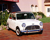 AUT 22 RK2052 01
1966 Austin Mini Cooper S White Black Top 3/4 Front View On Brick Pavement By Building