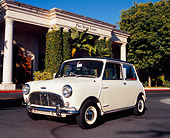 AUT 22 RK2058 02
1966 Austin Mini Cooper S White Black Top 3/4 Front View On Pavement By White Building