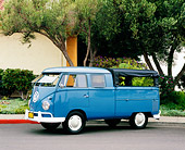 AUT 22 RK2072 06
1960 VW Double Cab Can Dove Blue 3/4 Side View On Pavement By Tree And Bushes