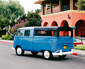 AUT 22 RK2075 02
1960 VW Double Cab Bus Dove Blue 3/4 Rear View On Pavement By Building
