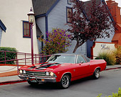 AUT 22 RK2076 04
1969 Chevy El Camino Red Black Stripe 3/4 Front View On Pavement By House
