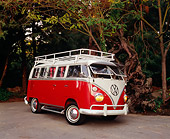 AUT 22 RK2094 02
1964 Volkswagen 13 Window Deluxe Bus Red And White Side 3/4 View On Pavement By Trees