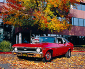 AUT 22 RK2129 02
1969 Chevy Nova SS Red 3/4 Front View On Pavement By Building And Fall Trees