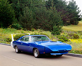 AUT 22 RK2149 01
1969 Dodge Daytona Charger Blue 3/4 Side View On Pavement By Bushes And Trees