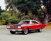 AUT 22 RK2203 02
1969 Plymouth GTX Red And Black 3/4 Front View On Pavement By Trees