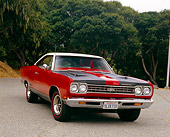 AUT 22 RK2205 01
1969 Plymouth GTX Red And Black 3/4 Front View On Pavement By Trees