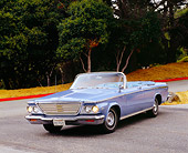 AUT 22 RK2223 01
1964 Chrysler Newport Convertible Blue 3/4 Front View On Pavement By Trees