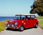 AUT 22 RK2237 02
1964 Morris Mini Cooper Red And White 3/4 Side View By Water And Tree