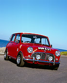 AUT 22 RK2238 02
1964 Morris, Mini Cooper, Red And White Slanted 3/4 Front View On Pavement By Water