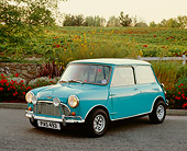 AUT 22 RK2240 02
1962 Austin, Mini Cooper, Light Blue And White 3/4 Front View On Pavement By Flowers