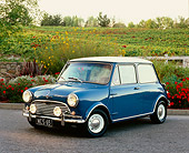 AUT 22 RK2247 02
1965 Morris Mini Cooper Blue And White 3/4 Front View On Pavement By Flowers