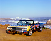 AUT 22 RK2265 05
1965 Chevrolet, Chevelle, Malibu Black With Flames Front 3/4 View On Sand By Ocean