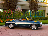 AUT 22 RK2381 01
1969 VW Karmann Ghia Convertible Green 3/4 Side View On Pavement By Trees