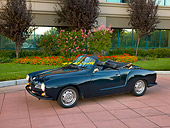 AUT 22 RK2382 01
1969 VW Karmann Ghia Convertible Green 3/4 Side View On Pavement By Trees