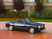 AUT 22 RK2383 01
1969 VW Karmann Ghia Convertible Green 3/4 Side View On Pavement By Trees