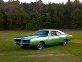 AUT 22 RK2386 01
1969 Dodge Charger R/T Green 3/4 Front View On Grass Trees