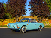 AUT 22 RK2394 01
1964 Volkswagen Karmann Ghia Type 3 Pacific Blue 3/4 Side View On Pavement Trees Background