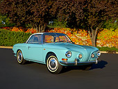 AUT 22 RK2395 01
1964 Volkswagen Karmann Ghia Type 3 Pacific Blue 3/4 Front View On Pavement Trees Background