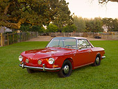 AUT 22 RK2400 01
1963 Volkswagen Karmann Ghia Type 3 Ruby Red 3/4 Front View On Grass