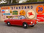 AUT 22 RK2402 01
1963 Volkswagen Karmann Ghia Type 3 Ruby Red 3/4 Side View On Pavement By Decals