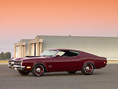 AUT 22 RK2595 01
1969 Mercury Cyclone Cobra Jet 428 Maroon 3/4 Side View On Pavement By Hangars