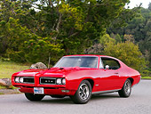 AUT 22 RK2638 01
1968 Pontiac GTO Solar Red 3/4 Front View By Trees