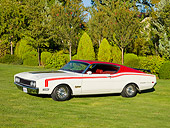 AUT 22 RK2706 01
1969 Mercury Cyclone White And Red 3/4 Front View On Grass By Trees