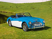 AUT 22 RK2709 01
1963 Austin-Healey BJ7 3000 Convertbile Blue And White 3/4 Front View On Grass By Pond