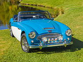 AUT 22 RK2711 01
1963 Austin-Healey BJ7 3000 Convertbile Blue And White 3/4 Front View On Grass By Pond