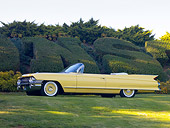 AUT 22 RK2712 01
1961 Cadillac Series 62 Convertible Yellow 3/4 Front View On Grass By Hedge
