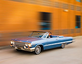 AUT 22 RK2727 01
1963 Chevrolet Impala Convertible Blue 3/4 Front View On Pavement By Building