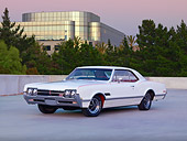 AUT 22 RK2728 01
1966 Oldsmobile 442 White 3/4 Front View On Pavement By Trees