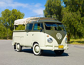 AUT 22 RK2799 01
1961 Volkswagen Double Cab Bus Green And Light Green 3/4 Front View On Pavement By Trees