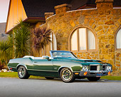 AUT 23 BK0033 01
1971 Oldsmobile 442 Green 3/4 Front View On Pavement By Building