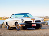 AUT 23 BK0036 01
1973 Oldsmobile Cutlass White And Gold Stripe 3/4 Front View On Gravel By Lake