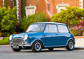 AUT 23 BK0043 01
1970 Mini Cooper S Blue 3/4 Front View On Pavement By House