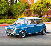 AUT 23 BK0045 01
1970 Mini Cooper S Blue 3/4 Front View On Pavement By House