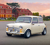 AUT 23 BK0062 01
1971 Mini 1000 Cream 3/4 Front View On Pavement By Brick Buildings