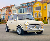 AUT 23 BK0064 01
1971 Mini 1000 Cream 3/4 Front View On Pavement By Colorful Houses