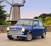 AUT 23 BK0067 01
1971 Austin Mini Cooper Blue 3/4 Front View On Pavement By Windmill