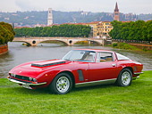 AUT 23 BK0068 01
1970 Iso Grifo Coupe Red 3/4 Front View On Grass By Water And Bridge