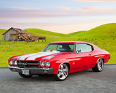 AUT 23 BK0069 01
1970 Chevrolet Chevelle SS 454 Red With White Stripe 3/4 Front View On Pavement By Grassy Hills And Old Shed