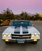 AUT 23 RK0037 02
1970 Chevy Chevelle 396 Silver Black Stripes Head On Shot Parking Lights On By Trees At Dusk Filtered
