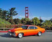 AUT 23 RK0514 02
1972 Chevrolet Nova Street Rod Orange 3/4 Side View On Pavement By SF Bridge And Bushes