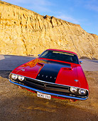 AUT 23 RK0527 02
1971 Dodge Challenger 426 Hemi Red And Black Slanted Head On On Sand By Rock