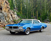AUT 23 RK0587 02
1970 Buick GS 455 Convertible Blue White Top Front 3/4 View oN Pavement By Trees